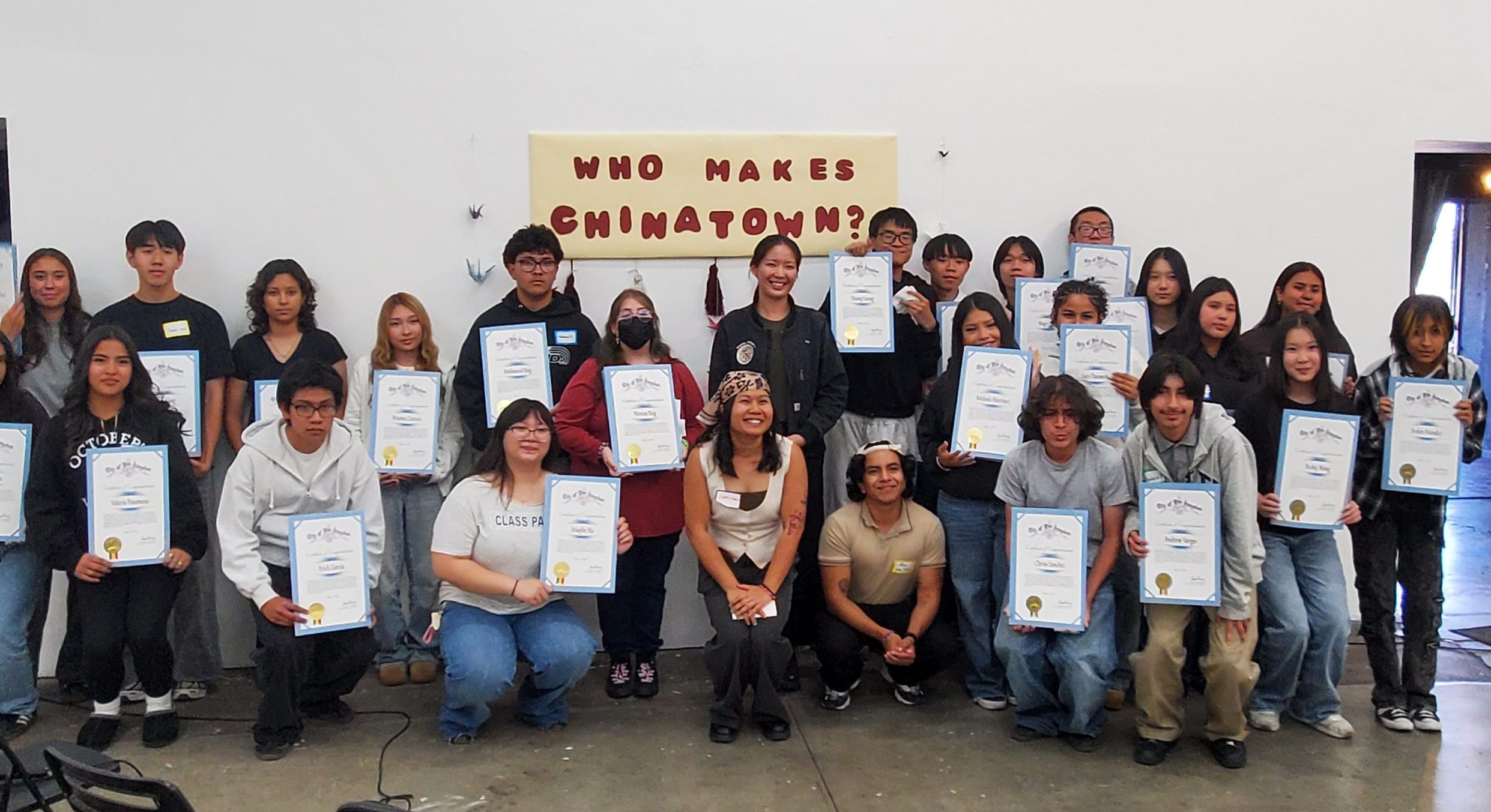 Group photo of SEACA students holding certificates